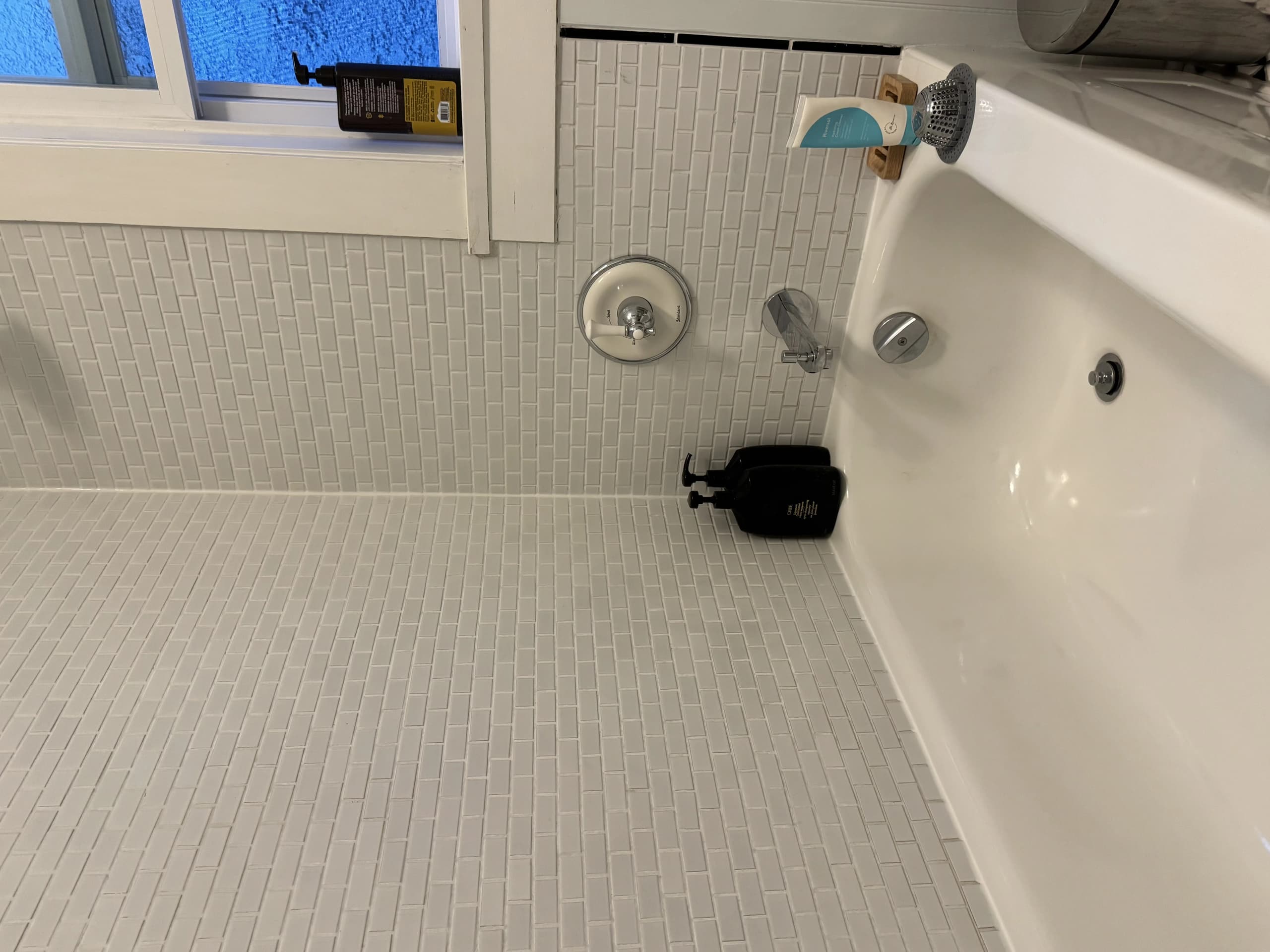 Sparkling clean vintage bathroom with original tile and fixtures after professional heritage home cleaning