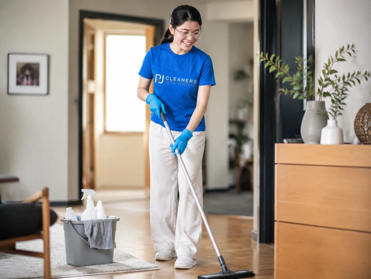 Professional cleaner arriving at client home with cleaning supplies