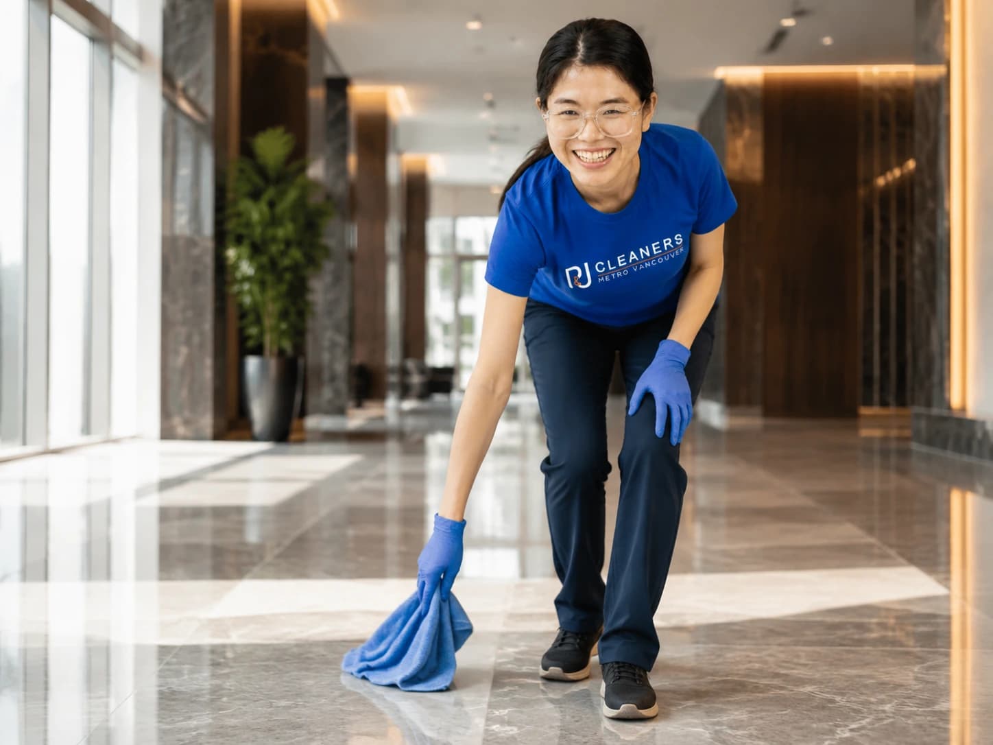 Professional cleaner polishing the floor of a grand corporate lobby